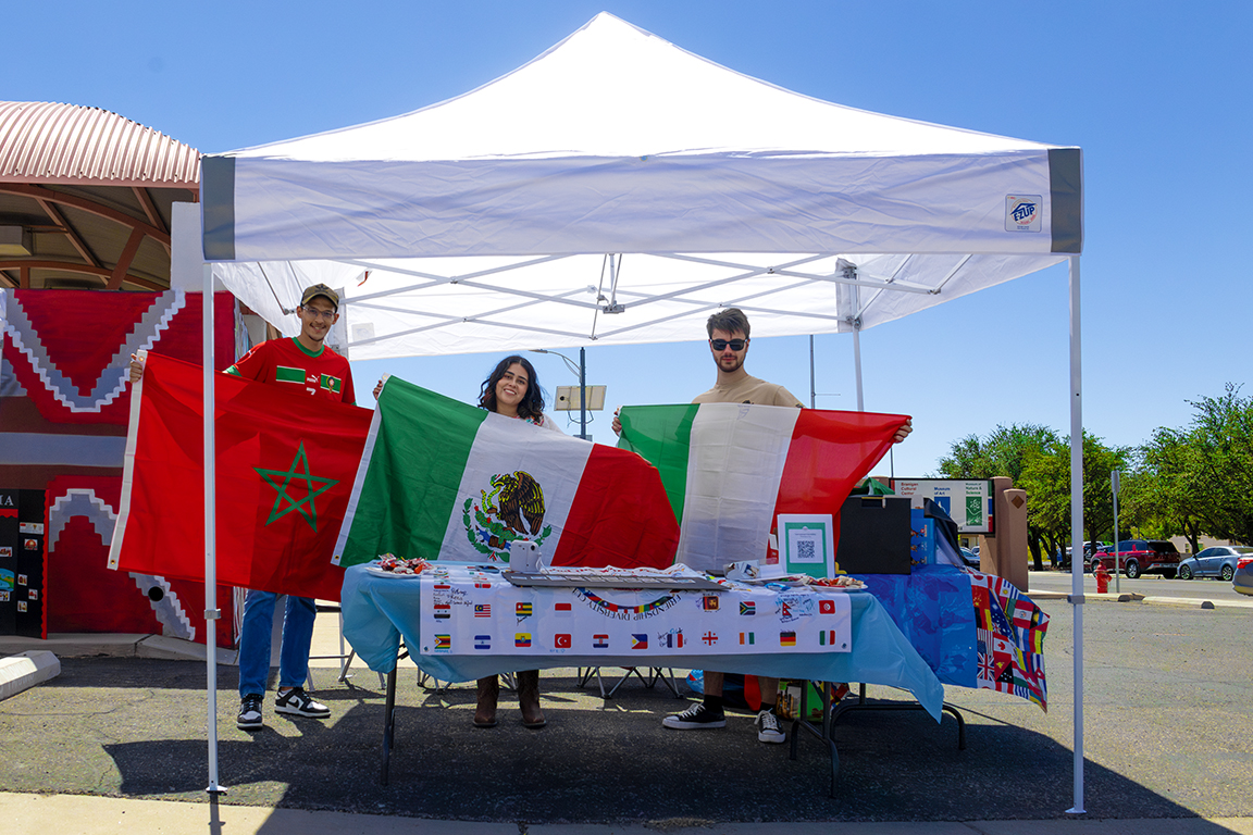 The NMSU International Club members (pictured left to right): Hamza Bradani, Rebecca Portillo, Giovanni Secreti hold the flags to their home countries. Sept. 21, 2024.