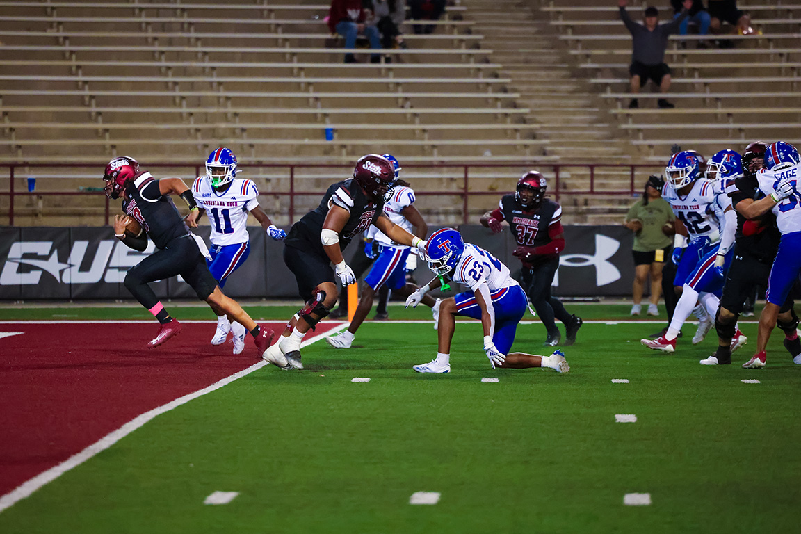 NM State quarterback Brandon Nunez scores a touchdown at Aggie Memorial Stadium on Oct. 15, 2024.  