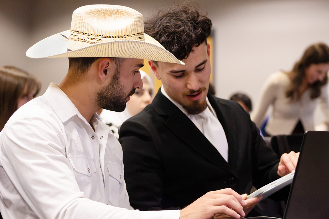 Senators Christopher Hamilton (left) and Aaren Ortiz-Ulibarri (right) talk during the Committee of the Whole. Oct. 17, 2024.  