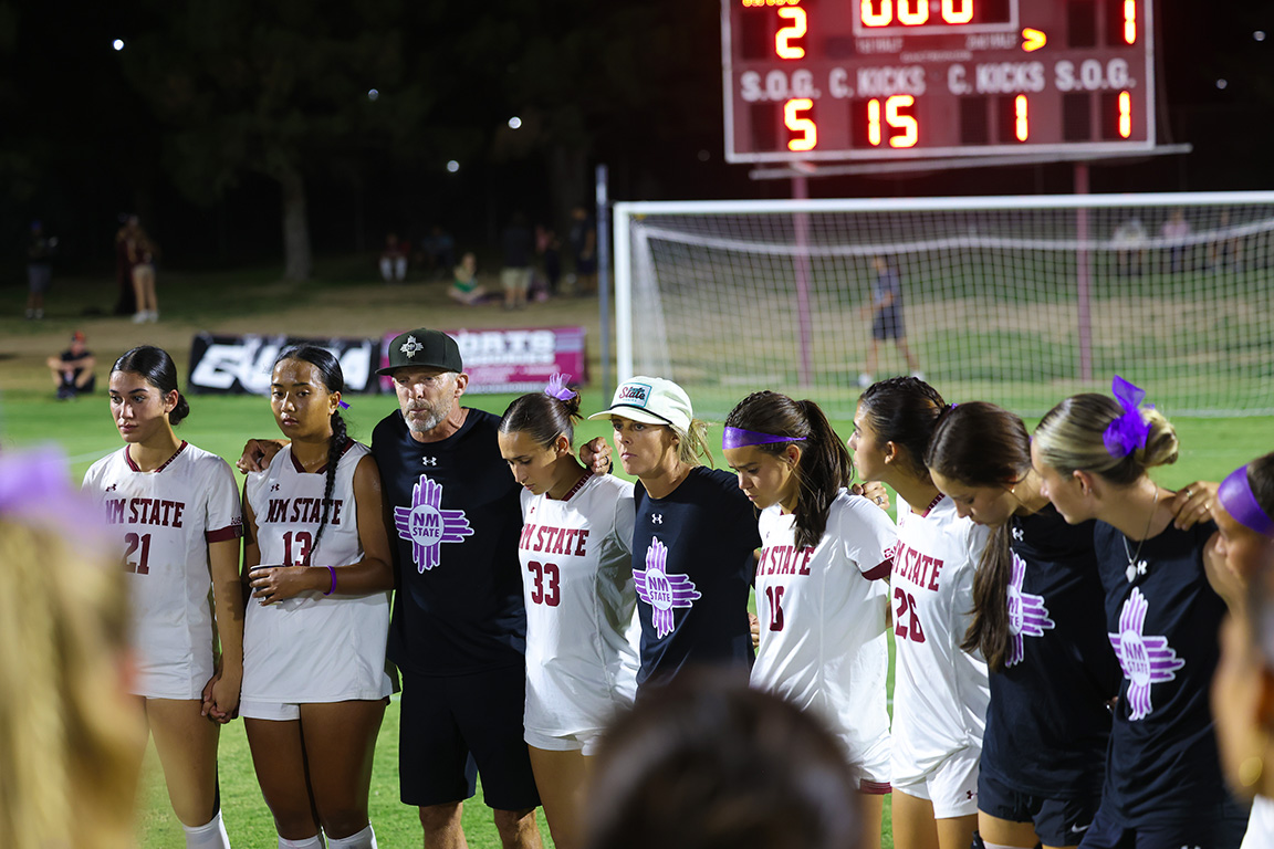 Rob Baarts, head coach of the NMSU Women’s Soccer team, talks with his players after a victory against the Texas A&M-Commerce Lions. Aug. 24, 2024. 
