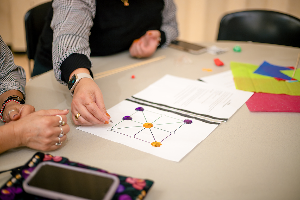 Attendees play Tapatan, a strategy game from the Philippines. Oct. 17, 2024. 