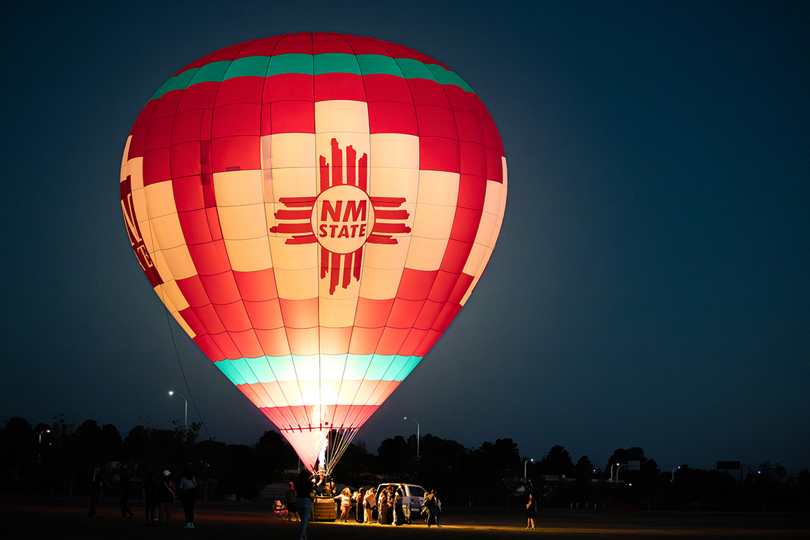 The “Aggie Up” balloon illuminates the sky as a part of the Burning of the Lobo events on Thursday, Sept. 26, 2024.