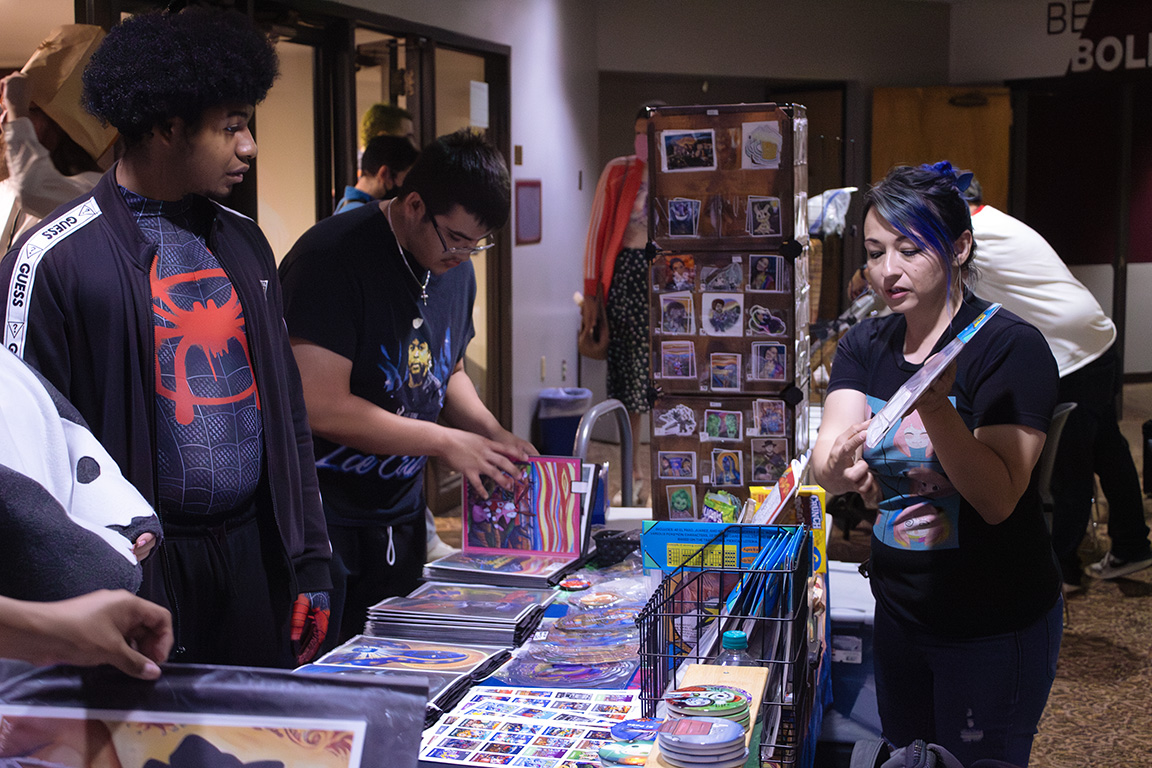 A local El Paso artist, Blanca Estrada, shows off her work to students attending the cosplay and anime convention. Oct. 23, 2024.  