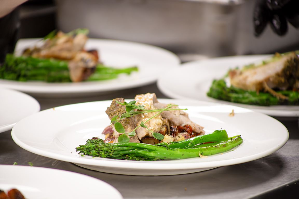 100 West Café’s “Welcome to Tuscany” menu featured porchetta with roasted potatoes and grilled broccolini. Oct. 24, 2024. 