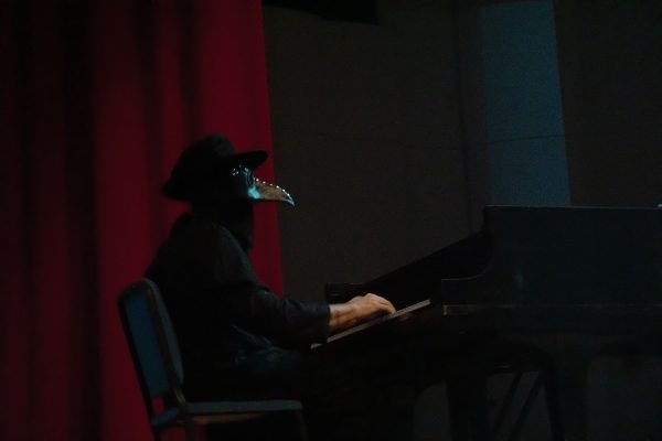 Masked pianist performs at NMSU's Silent Film. Oct. 30, 2024. 