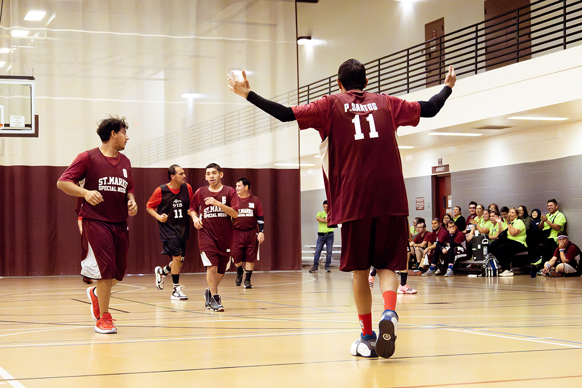 A St. Marks Special Olympics athlete waves his arms in the air during the game against the 915 Stars. Nov. 16, 2024.