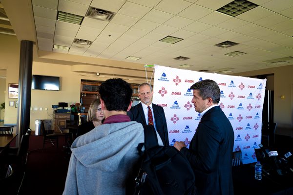 The Round Up News Editor Noah Apodaca briefly interviews NMSU President Valerio Ferme (middle) and the acting Director of Athletics, Amber Burdge (left). Jan. 3, 2025.