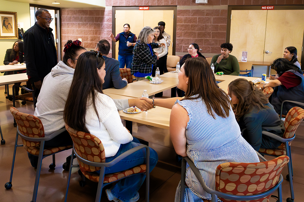 Attendees greet each other after rotating to a different table. Feb. 5, 2025. 