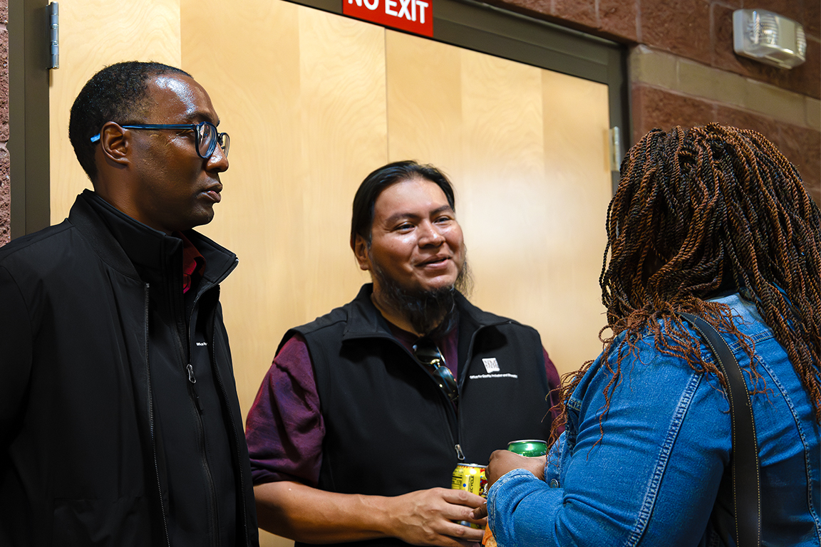 Cecil Rose (left) and American Indian Program Director Michael Ray (left) talk with a guest on Feb. 5, 2025. 