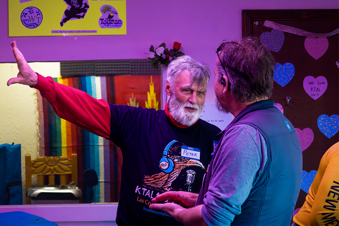 Peter Goodman informs an attendee on what is happening in the other rooms during the listening party. Feb. 15, 2025. 