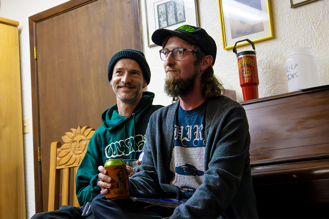 Two attendees sit together while they listen to music. Feb. 15, 2025. 