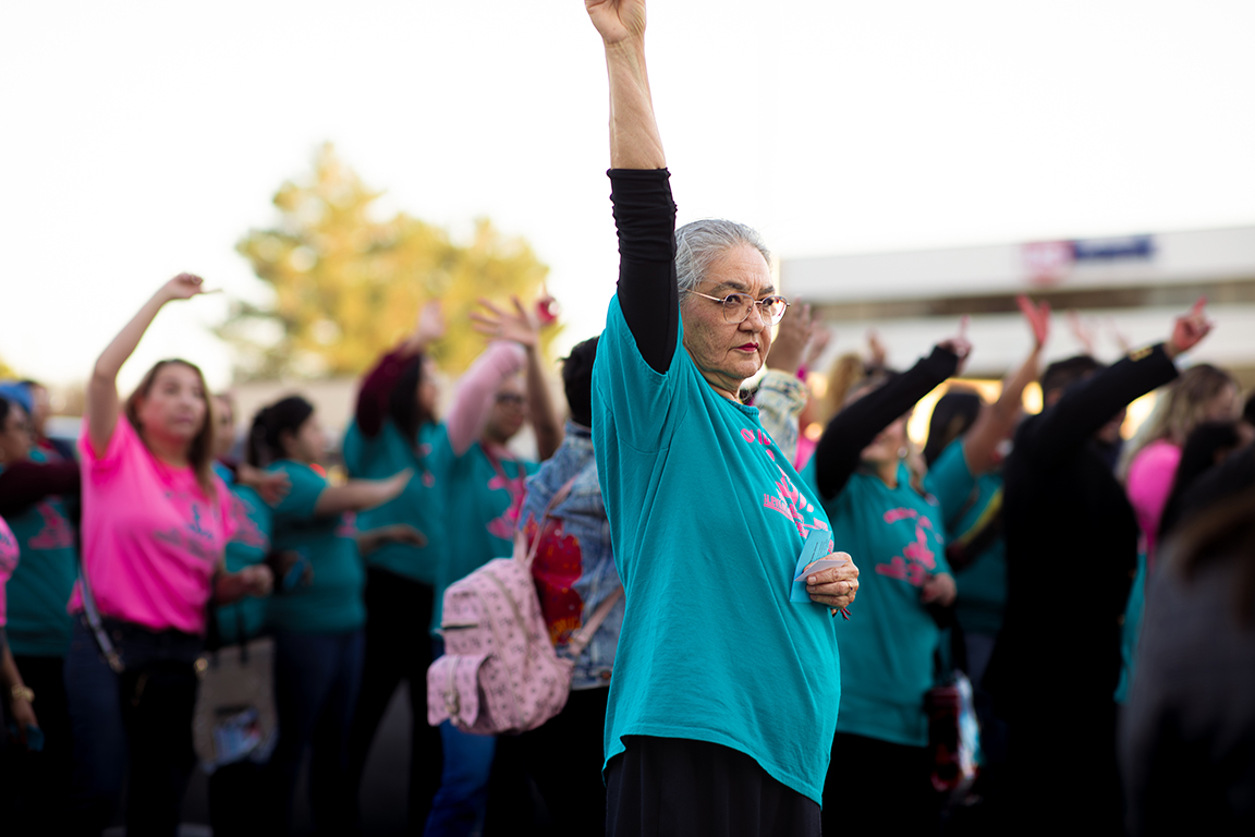 A woman raises her arm during the One Billion Rising event, which is a day of action for the international fight to end violence against women. Feb. 14, 2025. 