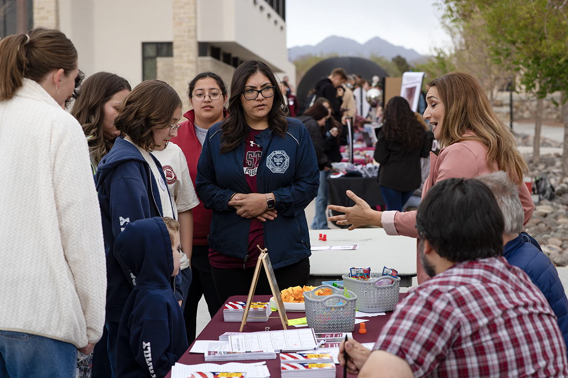 The Political Science booth talks with attendees about the department. April 3, 2025. 