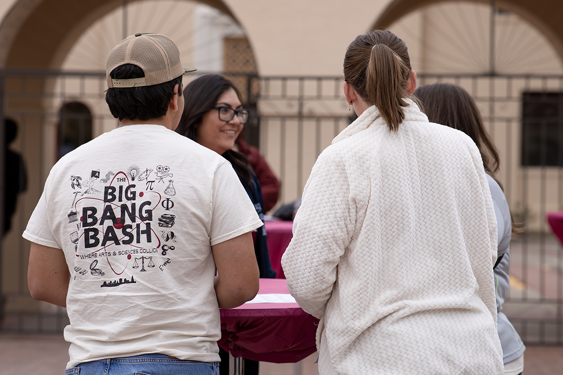 People gather around the tables set up in front of the University Museum. April 3, 2025. 