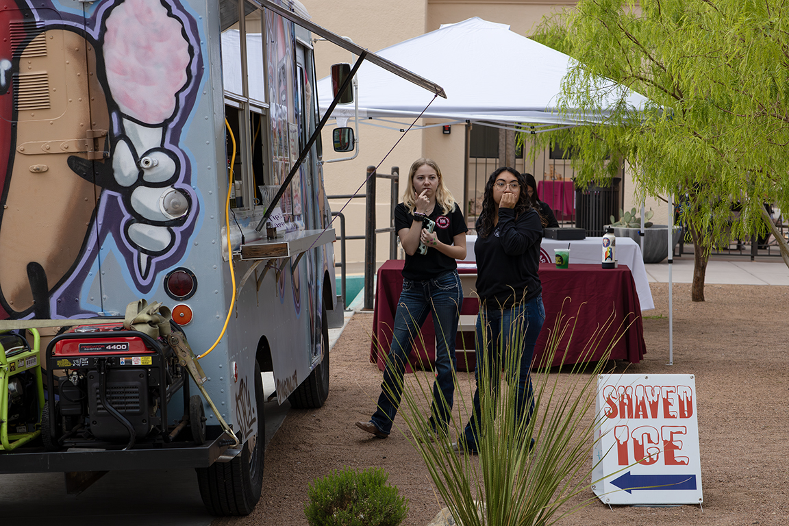 Two NMSU students debate which food truck to go to. April 3, 2025. 
