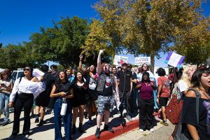 NMSU Aggies chant and cheer as the street preachers are escorted out by police. Sep. 23, 2025.