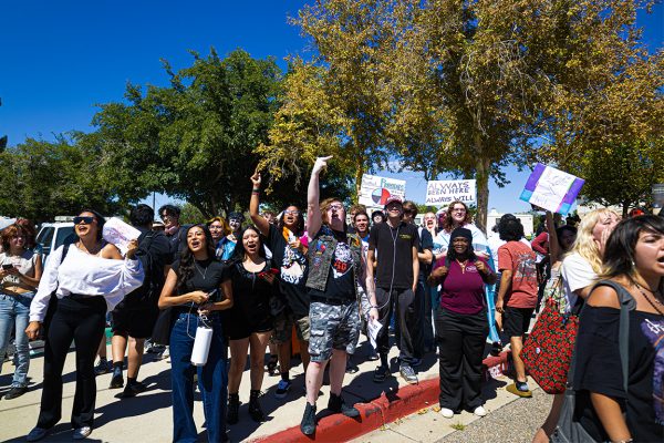 NMSU Aggies chant and cheer as the street preachers are escorted out by police. Sep. 23, 2025.