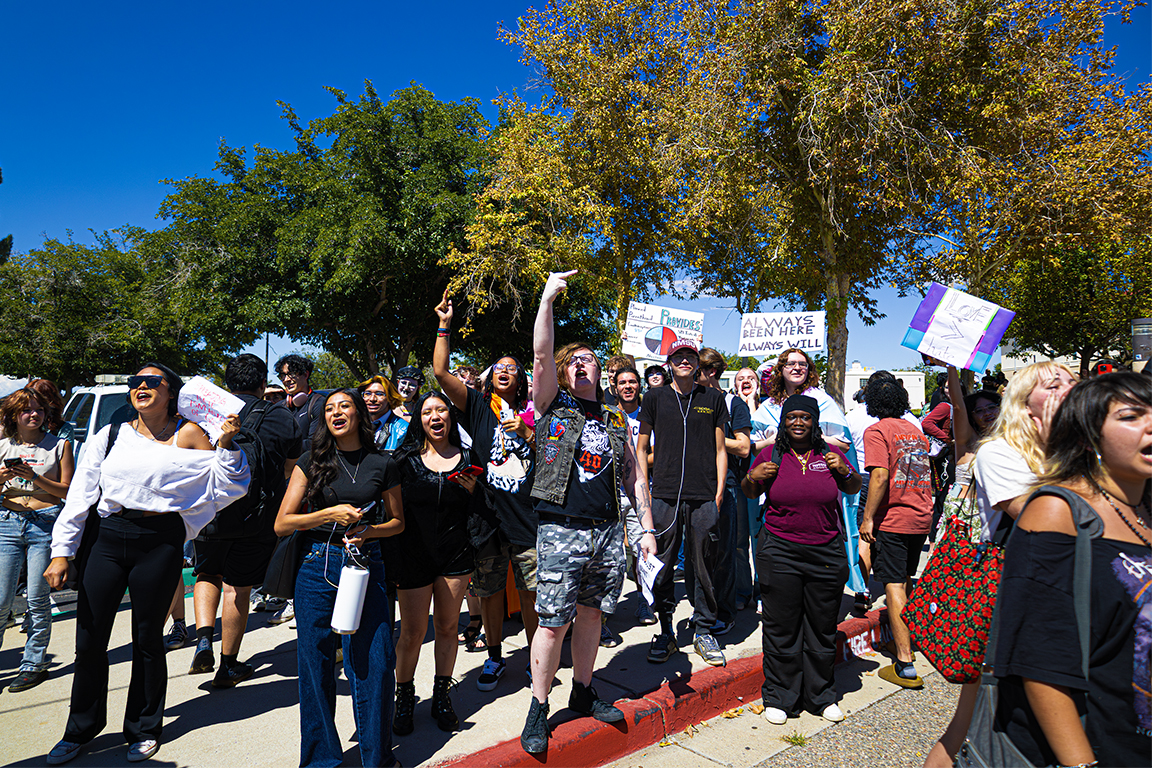 NMSU Aggies chant and cheer as the street preachers are escorted out by police. Sep. 23, 2025.