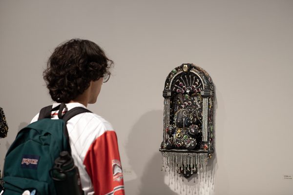 Guest taking a closer look at artwork. Sep.19, 2025 