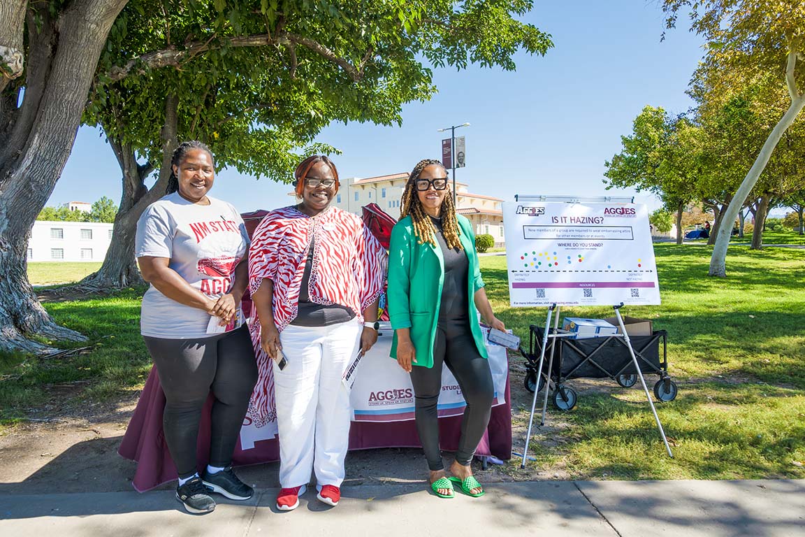 Karo Ademila, Charrissa Corbin, and Dr. Vanetta Busch organize the Anti-Hazing tabling event in honor of Anti-Hazing Awareness Week on Sept. 25, 2025. 