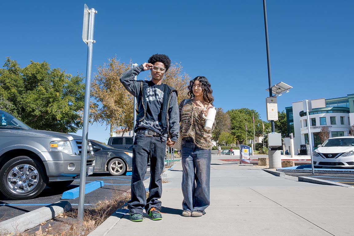 Couple Kaylon Keys and Denise Guerrero show off their fall fashion looks, both wearing baggy jeans. Keys pairs his with a studded shirt and belt, while Guerrero wears an oversized sweater. October 27, 2025.
