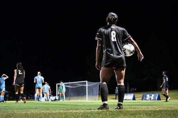 NMSU defender Marlee Cavitt prepares to throw the ball back into the game during the Aggies’ rainy matchup against LA Tech on October 11, 2025.