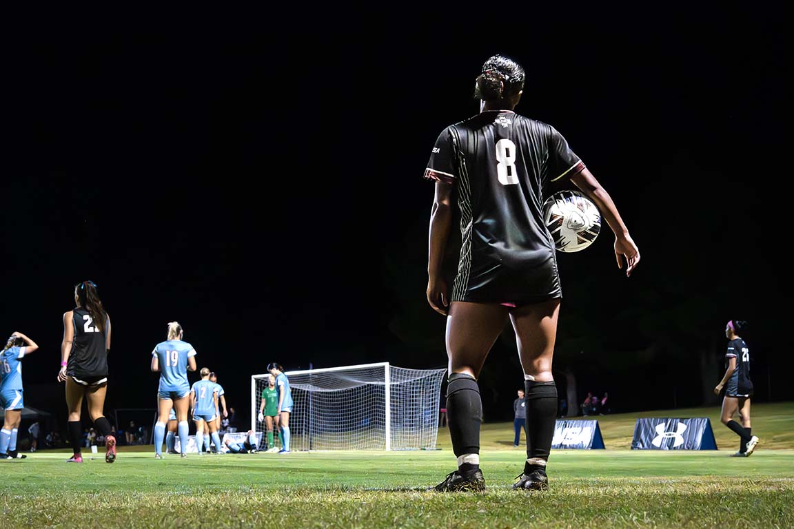 NMSU defender Marlee Cavitt prepares to throw the ball back into the game during the Aggies’ rainy matchup against LA Tech on October 11, 2025.