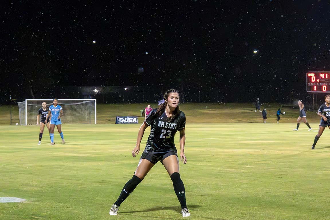 NMSU midfielder Meredith Scott stands ready on the field during the rainy home game against LA Tech on October 11, 2025.