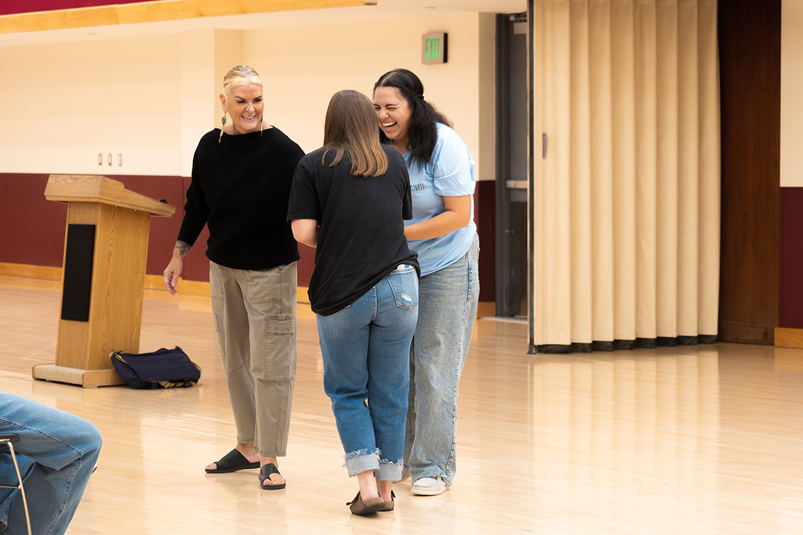 Tami Lara guides two NMSU Panhellenic members on how to use ones center of mass and balance in self defense situations. Sept. 24, 2025.
