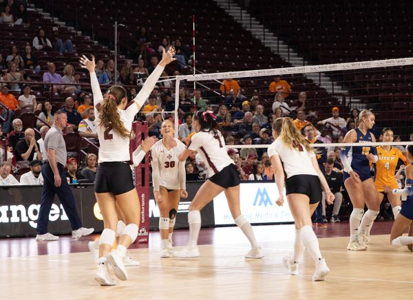 Aggies cheer as they add another point to the board. 
