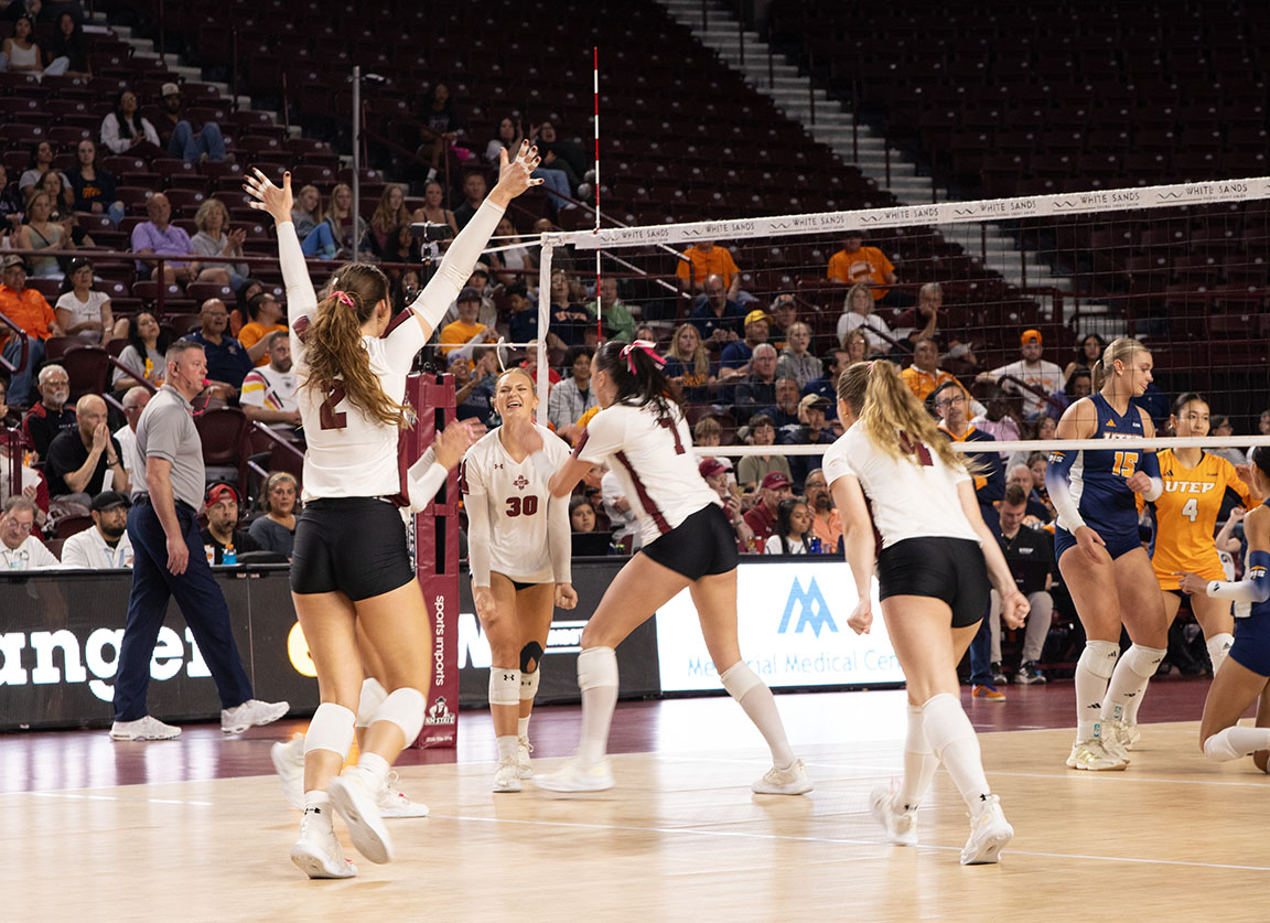Aggies cheer as they add another point to the board. 