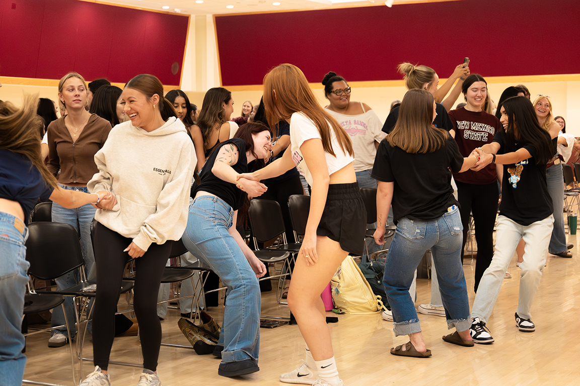 NMSU Panhellenic members practice getting out of a wrist hold during the Safety Tips for Female College Students event. Sept. 24, 2025.