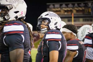 New Mexico State players look at the scoreboard from the sidelines during their game against Sam Houston on October 2, 2025.