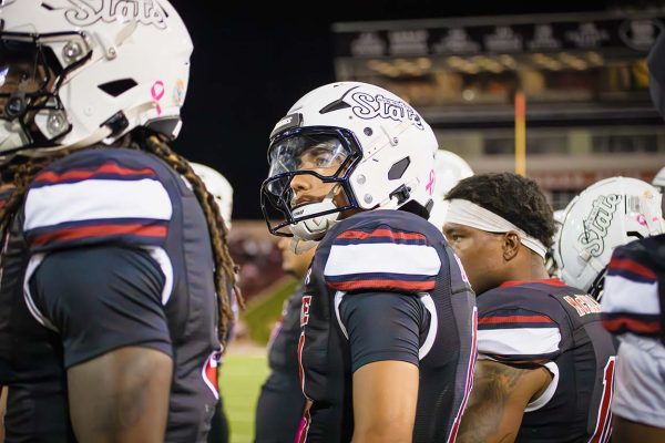 New Mexico State players look at the scoreboard from the sidelines during their game against Sam Houston on October 2, 2025.