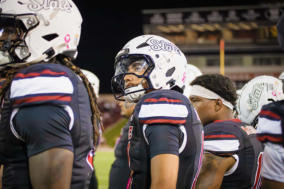 New Mexico State players look at the scoreboard from the sidelines during their game against Sam Houston on October 2, 2025.