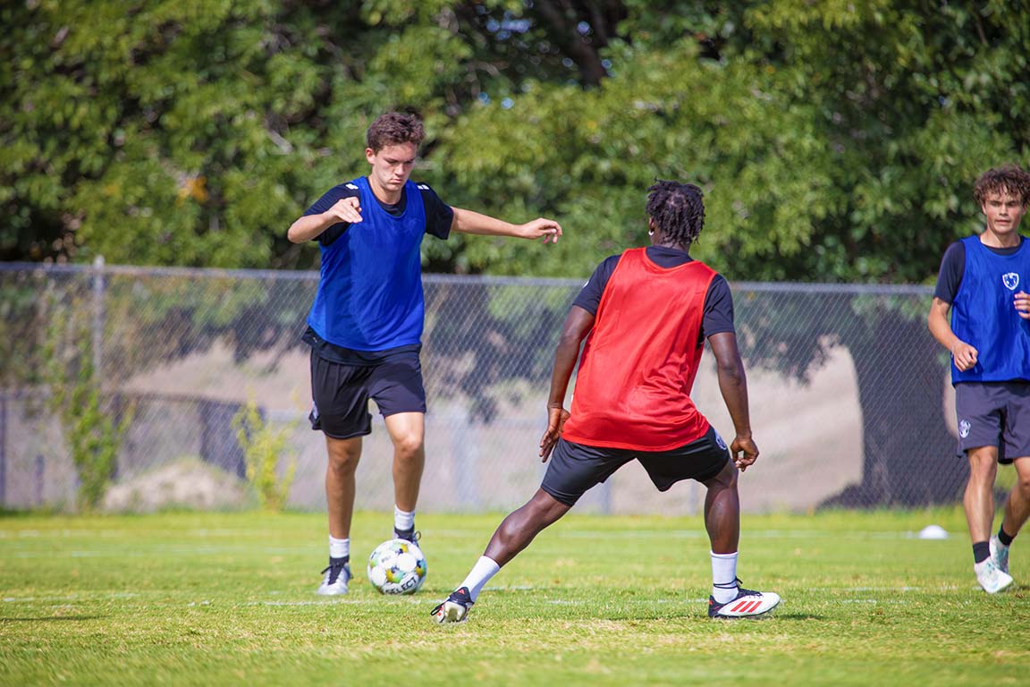 Jacob Leppert kicks the ball as another player closes in during the UDA NMSU practice on September 26, 2025. 