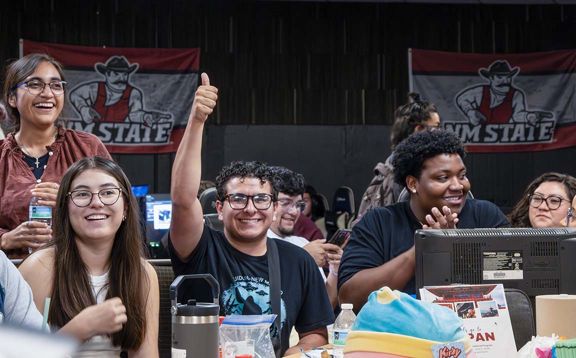 A student smiles and gives a thumbs-up after winning a round of Loteria at Cultural Game Night on Oct. 10, 2025. 