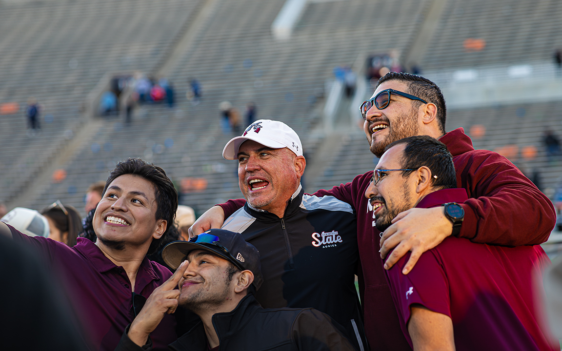 Head coach Tony Sanchez celebrates with Aggie fans. Nov. 22, 2025. 