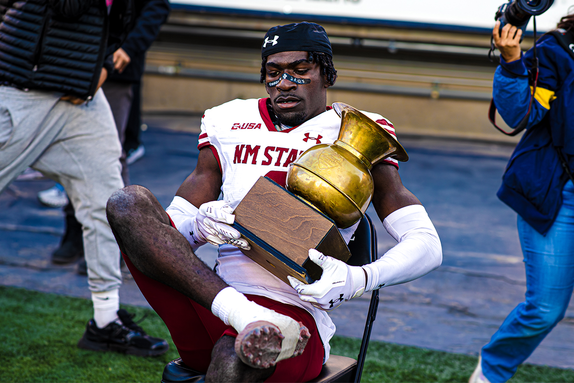 Bernock Iya sits with the Battle of I-10 trophy. Nov. 22, 2025. 