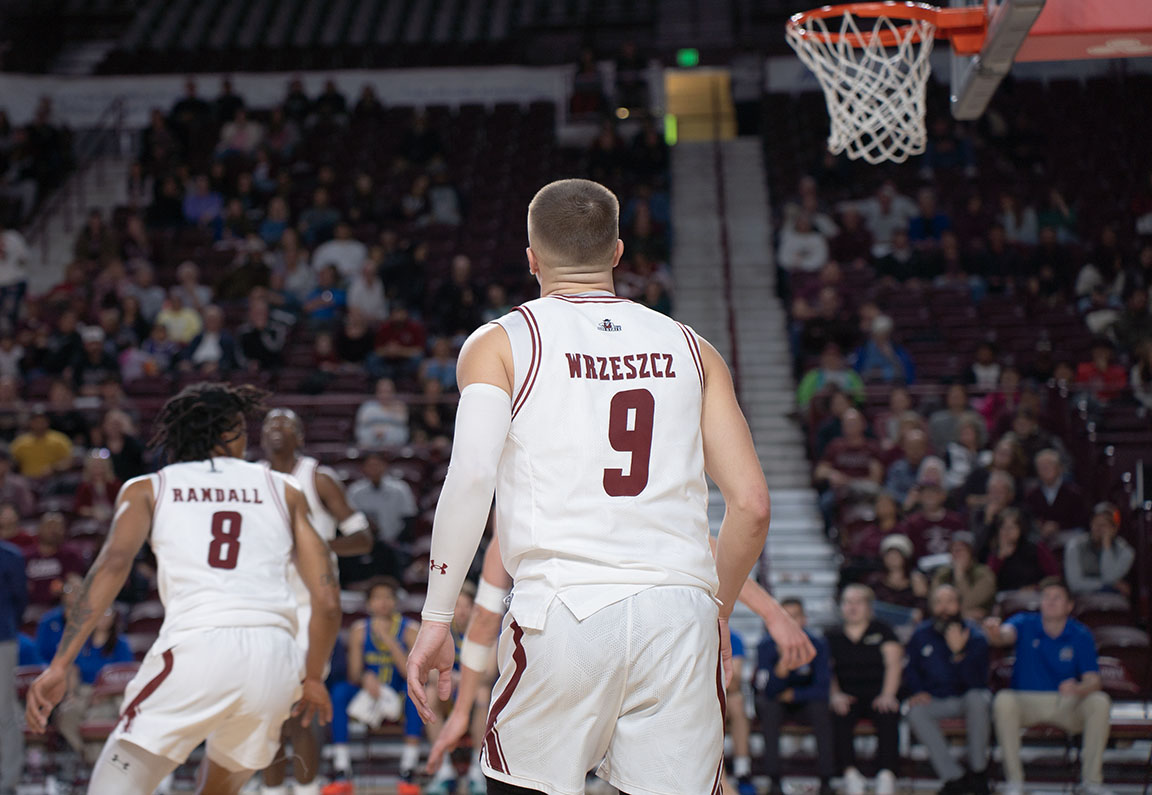 NMSU players #8 Jayland Randall and #9 Anthony Wrzeszcz compete on the court against Delaware.