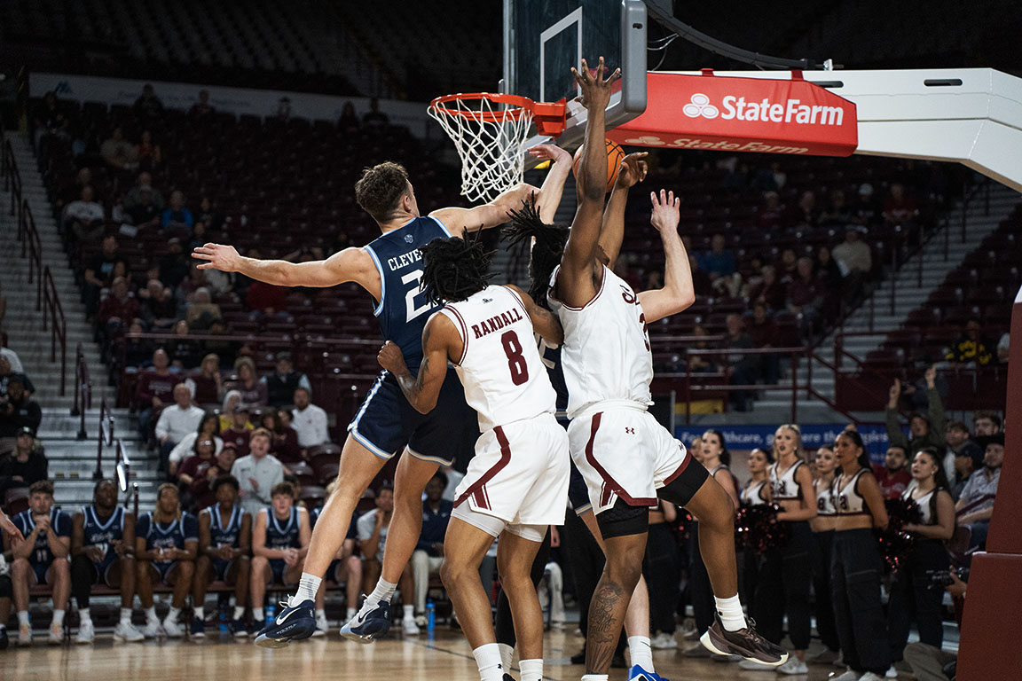 NMSU’s #3 Kyrese Mullen and #8 Jayland Randall work together to stop a Liberty player from scoring during Wednesday night’s matchup.