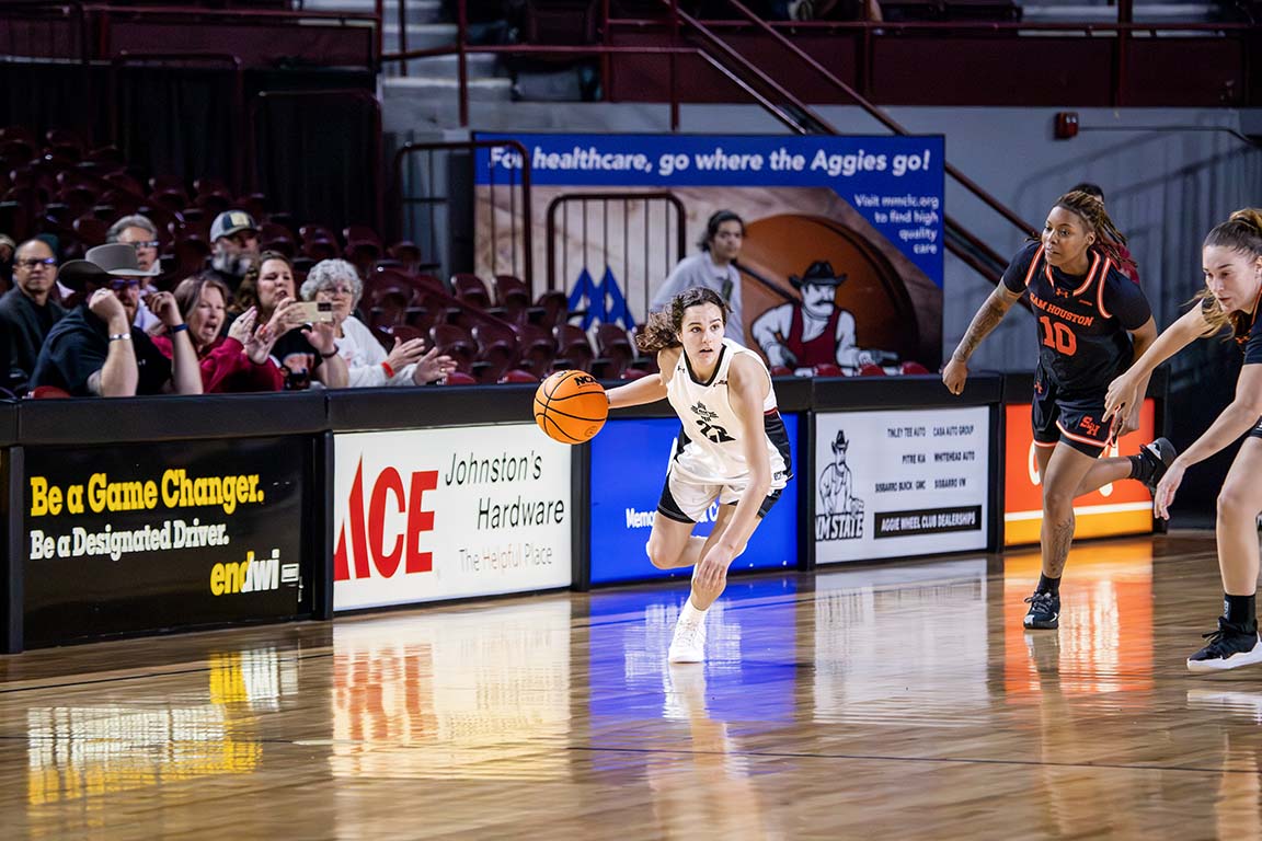 Running toward the basket, guard Emma Christiano dribbles past Sam Houston defenders. Feb. 5, 2025.