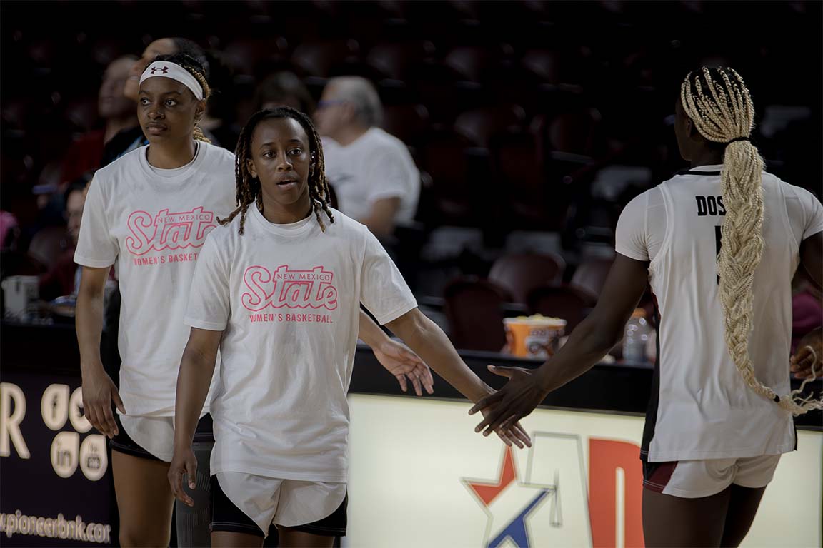 NMSU players at halftime, putting up three-pointers and sharpening their layups as they prepare for the second half. Feb. 26, 2026.