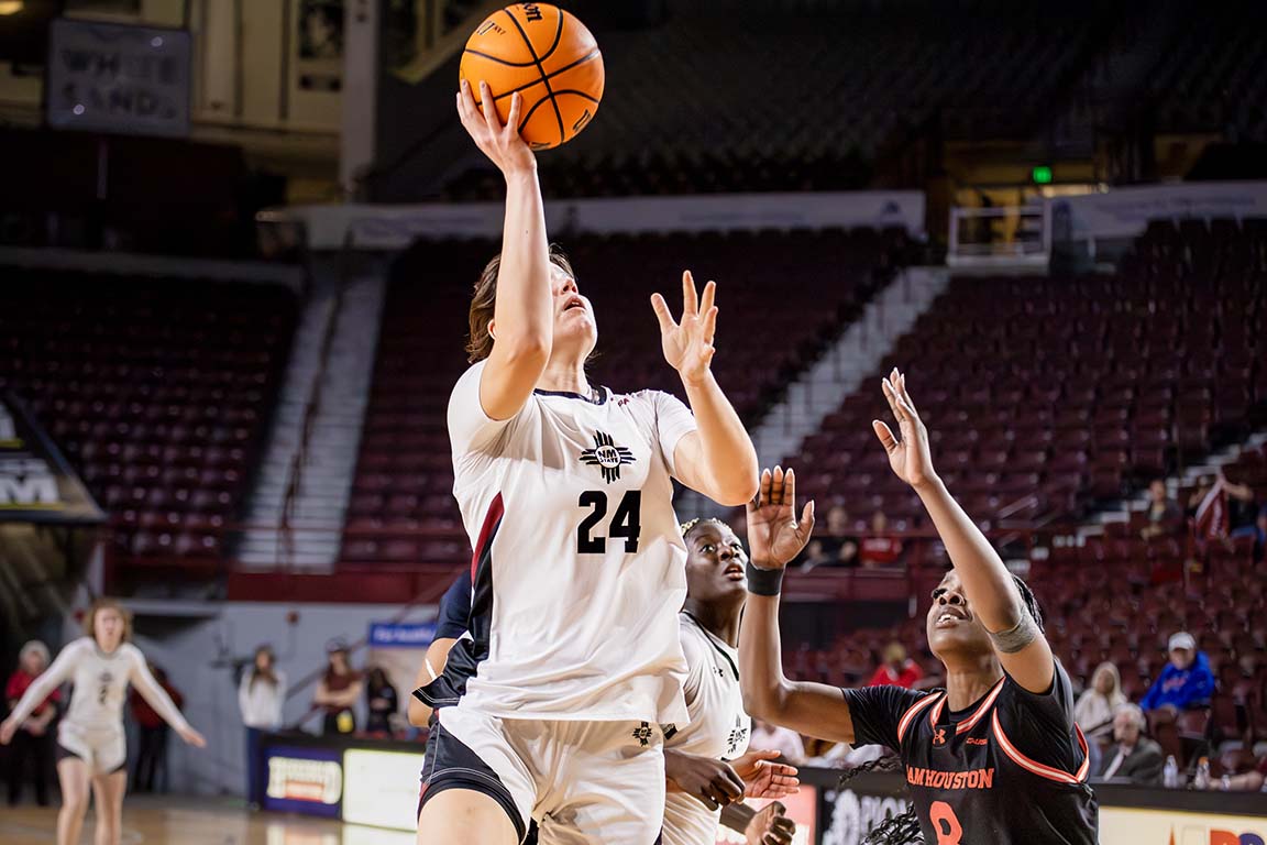 After the ball comes off the rim, forward Lucía Yenes secures a rebound. Feb. 5, 2025.