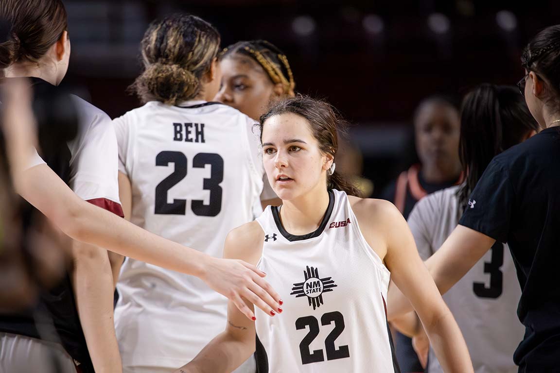 Following the final buzzer, guard Emma Christiano (22) celebrates with teammates after NMSU’s 65–57 victory. Feb. 5, 2025.
