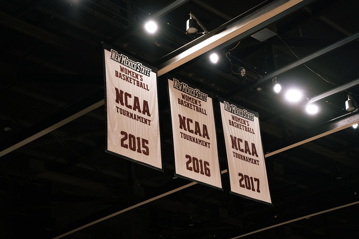 Banners from the 2015, 2016 and 2017 NCAA Women’s Basketball Tournaments hang inside the Pan American Center on March 8. 