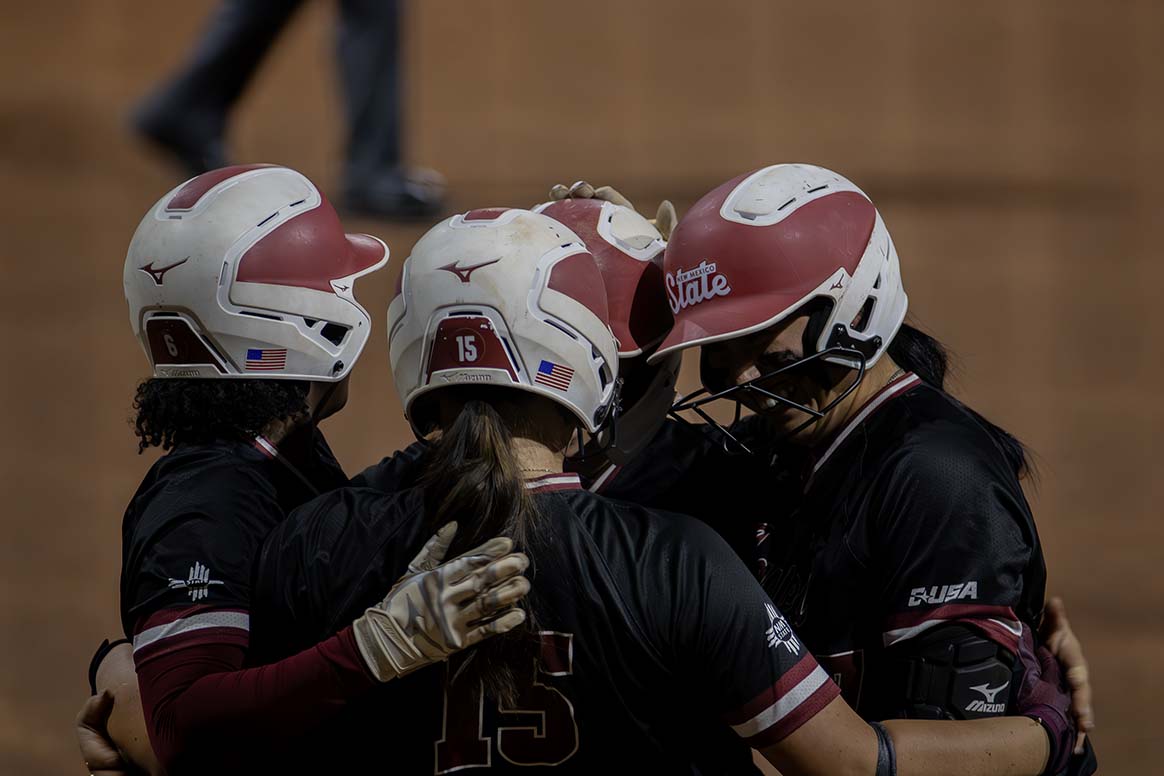 The NMSU softball team celebrates after a home run helped them score five runs in the third inning against LA Tech. March 6, 2026. 