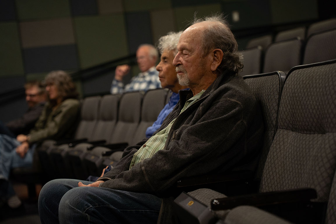 An attendee listens during a reading event at New Mexico State University.