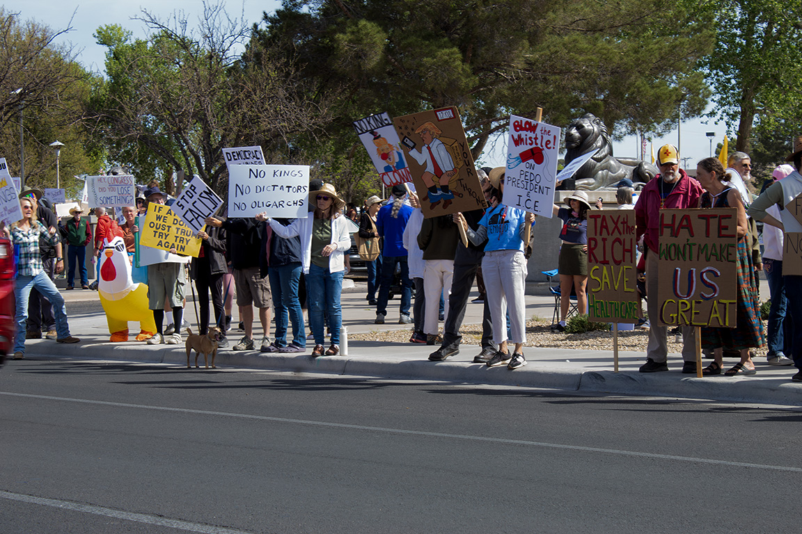 Dozens of protesters stand on N. Main Steet with a signs that say "Stop Fascism," "Blow the Whistle! on Pedo President and I.C.E." and "Hate won't make US great." March 28, 2026.
