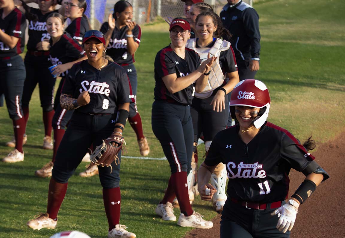 Player runs while teammates cheer her on, March 27, 2026. 